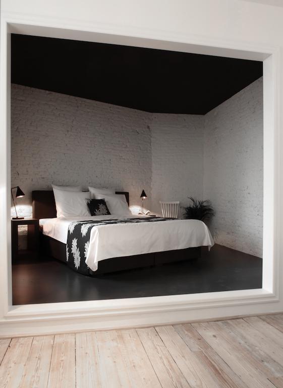 Maison Nationale City Flats & Suites Anversa Camera foto A bedroom